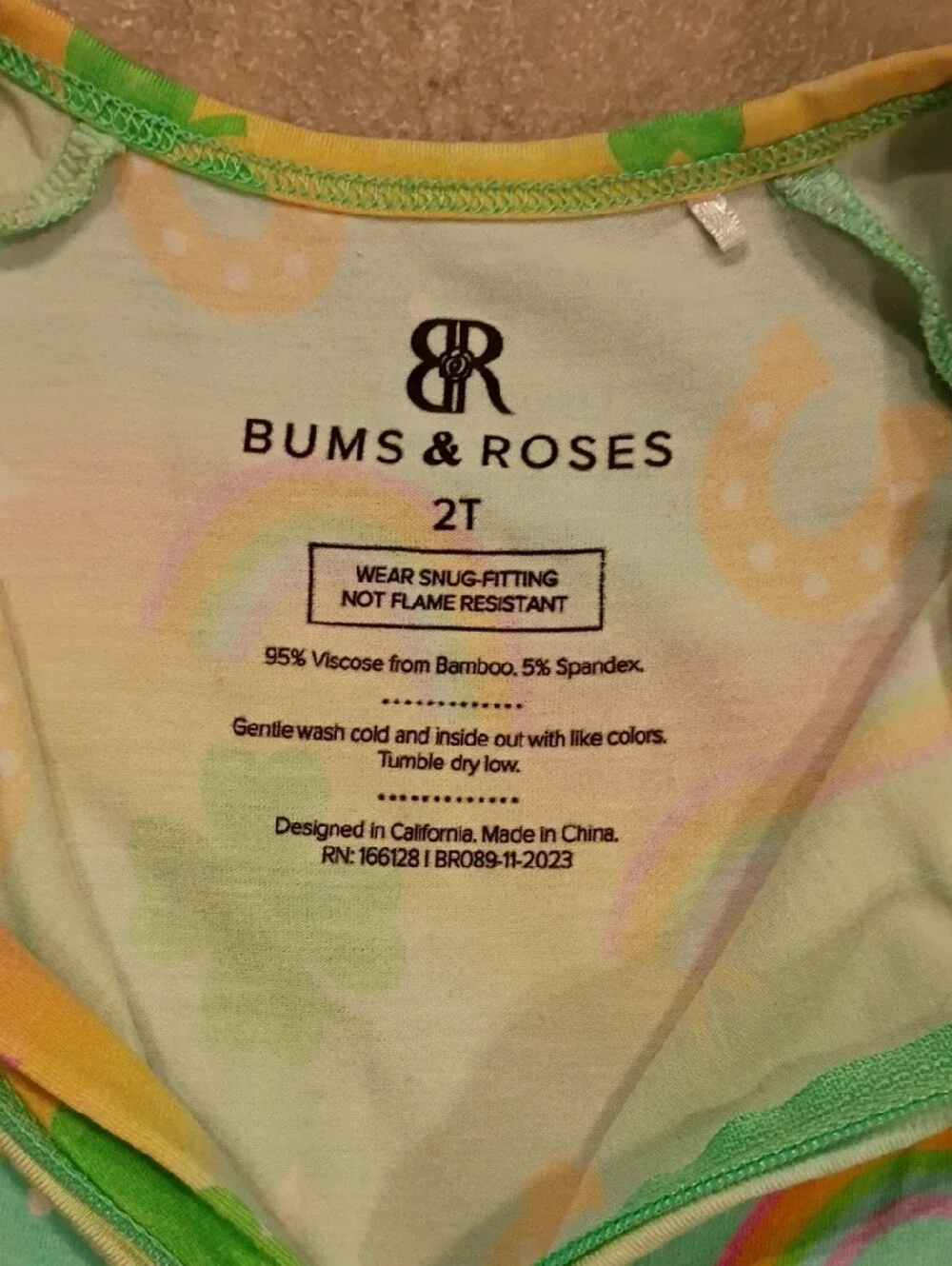 Bums And Roses 2t Footed One-Piece with Rainbow & Clover Print